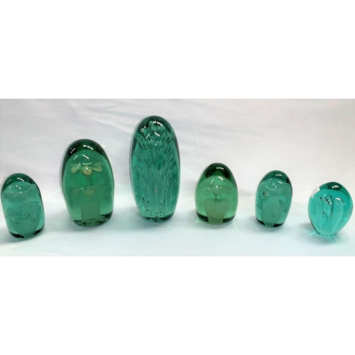 177 - A collection of 6 various Victorian green glass dumpies with bubble/floral inclusions, heights 9-19 ... 