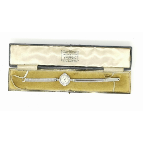 312 - A 1930's ladies Vertex cocktail watch, the white metal case set 24 diamonds, stamped '18ct', strap m... 