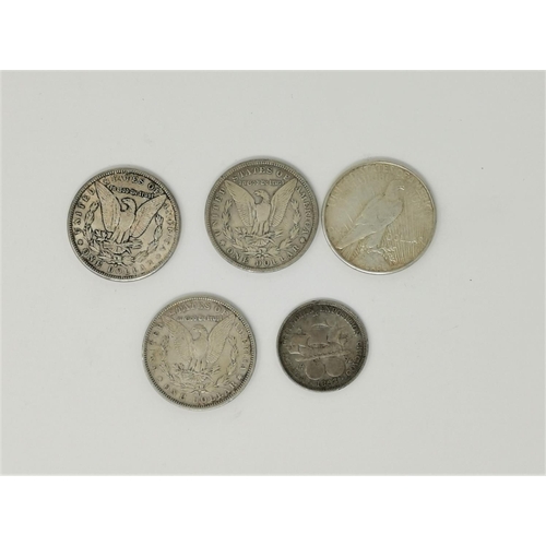 404 - Four US silver dollars:  1879, 1884, 1891 & 1926; a half dollar 1893