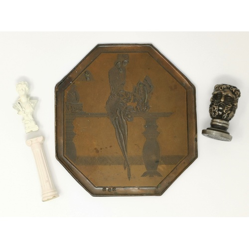 402 - A cast and bronzed metal printing plate depicting a stylish 1920's woman, 18 cm high; a seal with mu... 