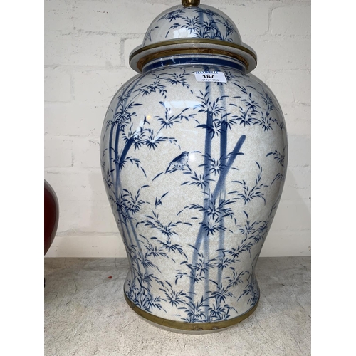 187 - A large Chinese baluster covered vase, with crackle glaze decorated in blue & white with birds in ba... 