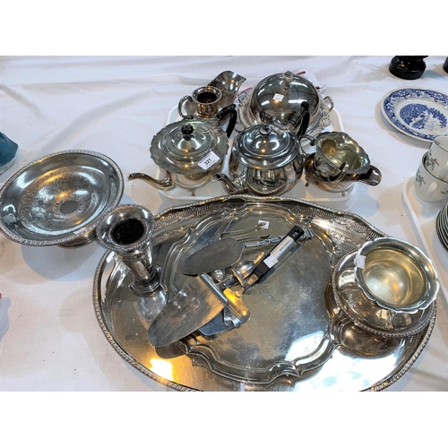 321 - A silver plated 3 piece tea set; an oval gallery tray; an ornate muffin dish; other silver plate