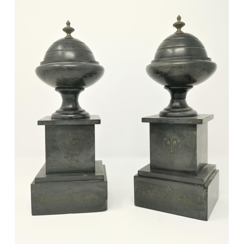 425 - A pair of polished black slate mantel urns on square bases, brass finials, 31 cm