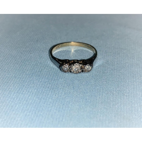 309 - A 3 stone diamond ring, stamped '9 ct', 2gm
