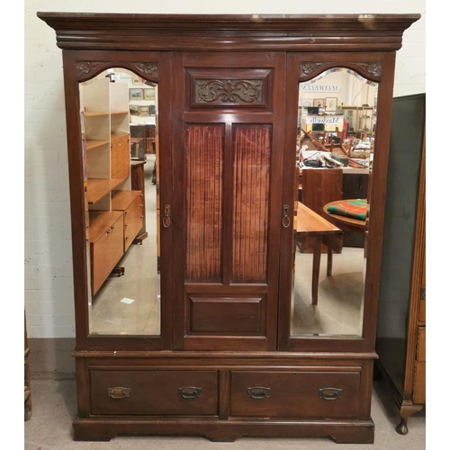 631 - An Edwardian carved walnut wardrobe with 2 mirror doors and base drawer