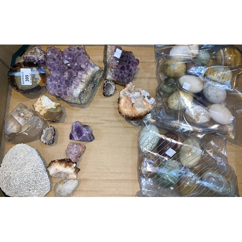 395 - A selection of amethyst and other rock specimens; a collection of onyx and other eggs