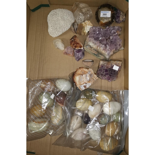 395 - A selection of amethyst and other rock specimens; a collection of onyx and other eggs