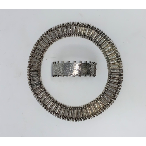 317 - A Victorian white metal choker and bangle, ornately beaded and chased