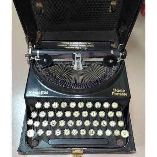 363b - An early 20th century Remington 'Home Portable' typewriter in case; Bells Punch Company adding machi... 
