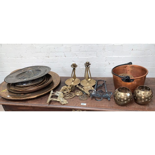 97 - A pair of ship's brass candlesticks, a copper jam pan, brass plaques and other copper and brassware
