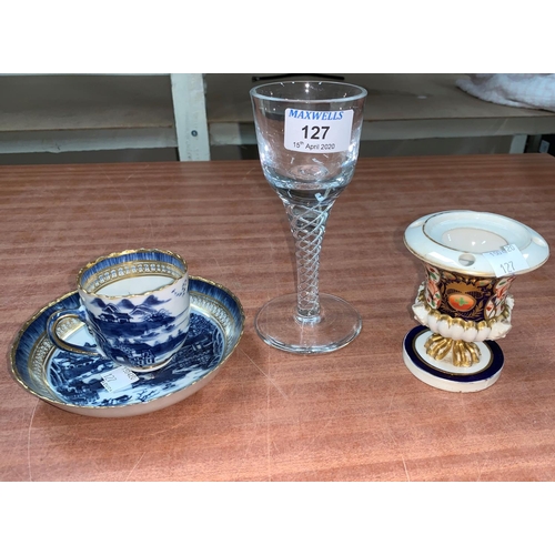 127 - An 18th century style air twist wine; an early 19th century English porcelain coffee cup and saucer ... 