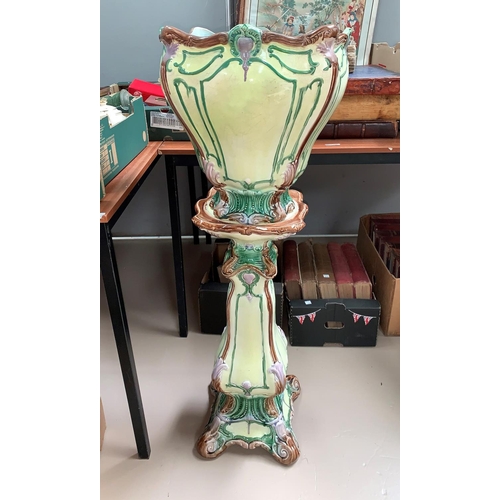 57A - A Art Nouveau majolica jardiniere on stand, rim and feet restored