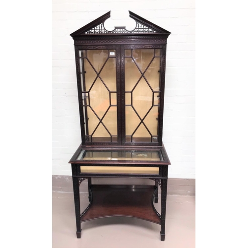 571 - A late 19th century mahogany full height display/bijouterie cabinet in the Chippendale style with ex... 