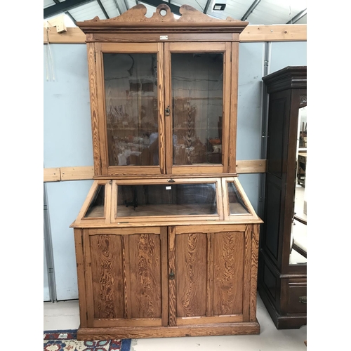 577 - A 19th century pitch pine museum display cabinet, full height, with 2 glazed doors and fall front di... 