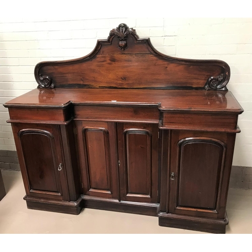581 - A Victorian mahogany 4 door sideboard with reverse breakfront, carved raised back, 3 frieze drawers ... 
