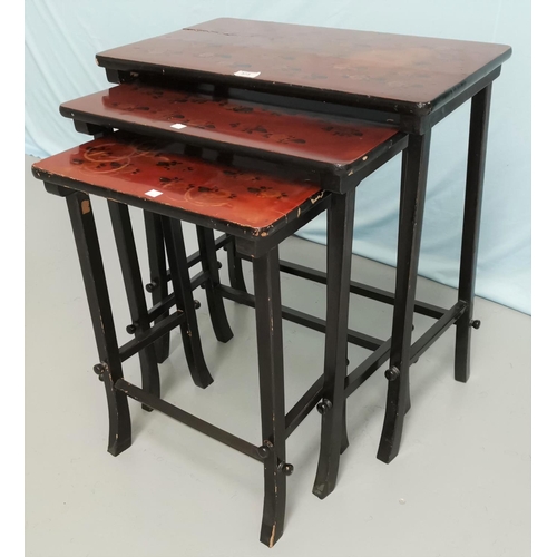 573 - A nest of red lacquered occasional table with rectangular tops