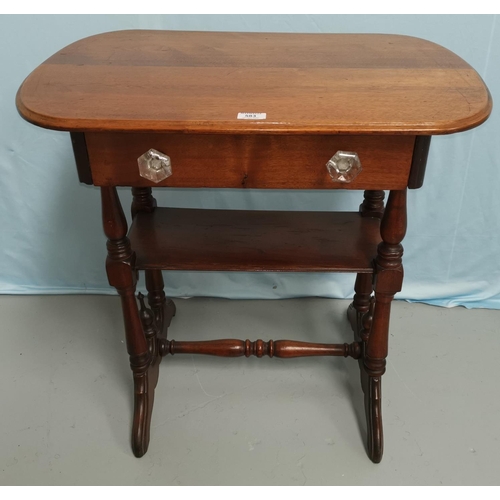 583 - A Victorian mahogany occasional table with rounded rectangular top, frieze drawer and 2 shelves unde... 
