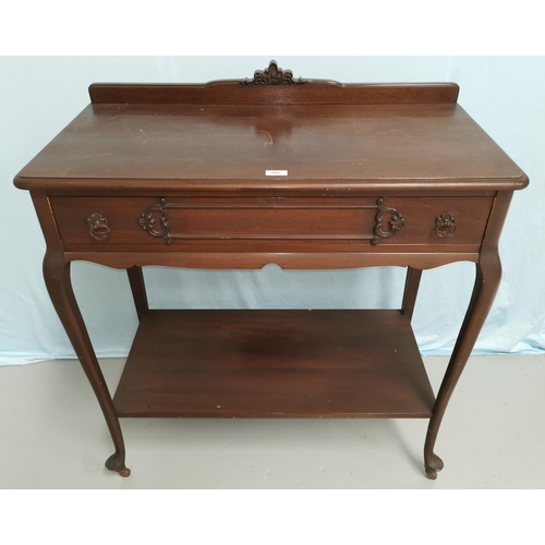 585 - An Edwardian mahogany side table with frieze drawer and undershelf, on cabriole legs