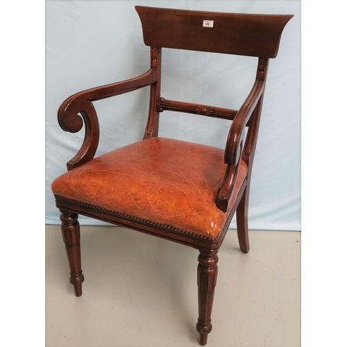 586 - A Regency mahogany carver chair with wide top rail and scroll arms, on turned fluted legs
