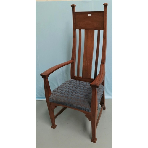 596 - An Art Nouveau walnut armchair with high back, on square supports