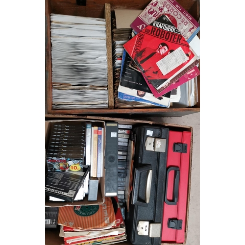 94 - A large collection of 1960's and later singles, unused cassette tapes and a disc player