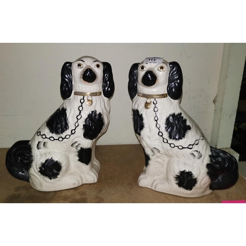 113 - A pair of Staffordshire style dogs, vases