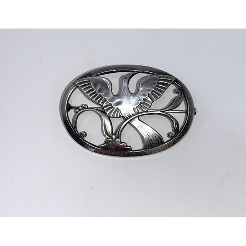 269 - Georg Jensen, an oval Danish silver brooch with stylised Bird Of Paradise with outstretched wings, s... 