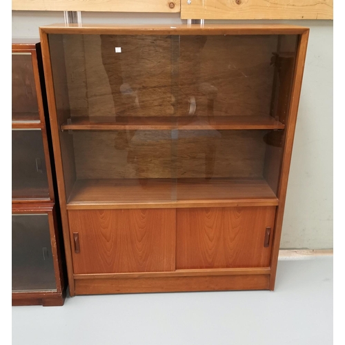 675 - A 1960's teak display cabinet with 2 glass and 2 panelled doors by Gibbs furniture