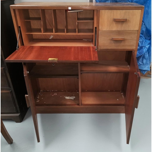 681 - A 1960's side cabinet with fall front; various cupboards