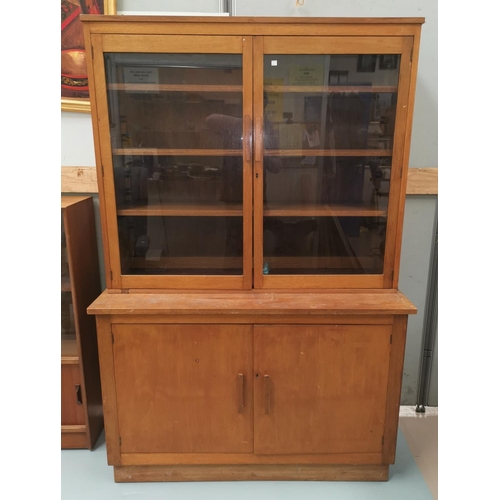 682 - A 1930's stained oak full height bookcase with 2 glazed and 2 panelled doors