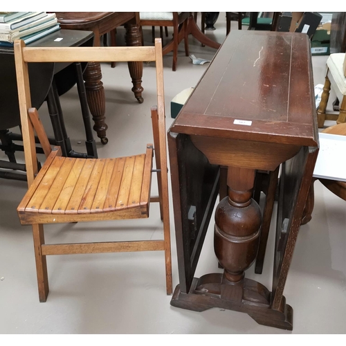 567 - A 1930's oak 2 door display cabinet; a 1930's oak drop leaf dining table on bulbous legs; a folding ... 