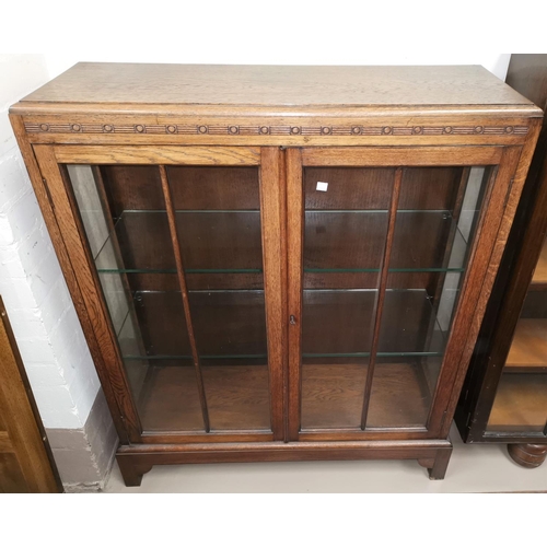 567 - A 1930's oak 2 door display cabinet; a 1930's oak drop leaf dining table on bulbous legs; a folding ... 