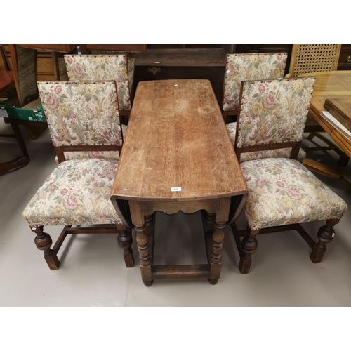 568 - A Titchmarsh & Goodwin drop leaf dining table and four dining chairs upholstered in floral fabric