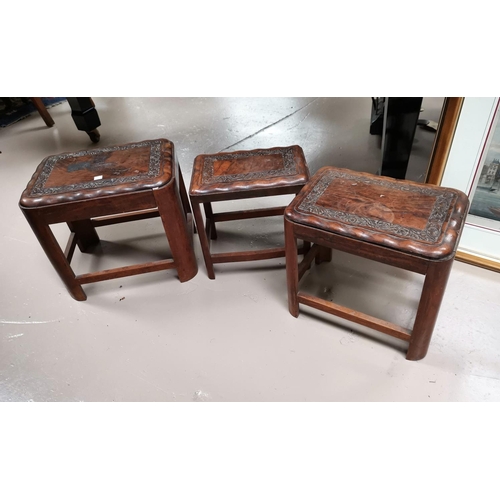 673 - A nest of 3 oriental carved hardwood occasional tables