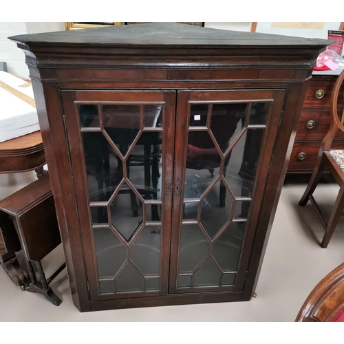 679 - A 19th century mahogany straight front corner cupboard enclosed by 2 glazed doors