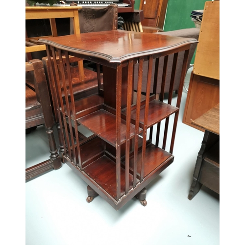 693 - An Edwardian revolving mahogany bookcase