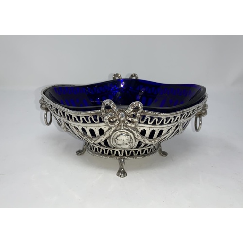 274A - A Georgian style white metal bowl stamped 925 with blue liner, flower and swag decoration with embos... 
