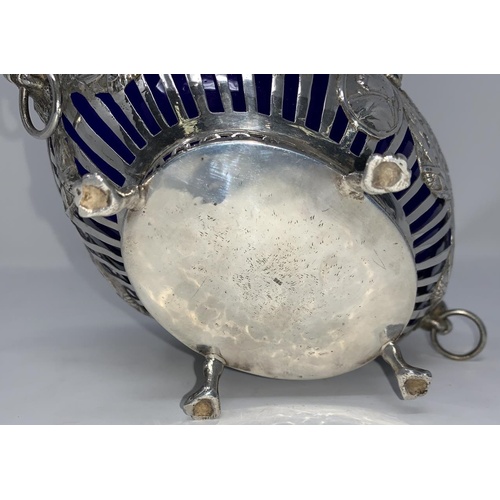 274A - A Georgian style white metal bowl stamped 925 with blue liner, flower and swag decoration with embos... 
