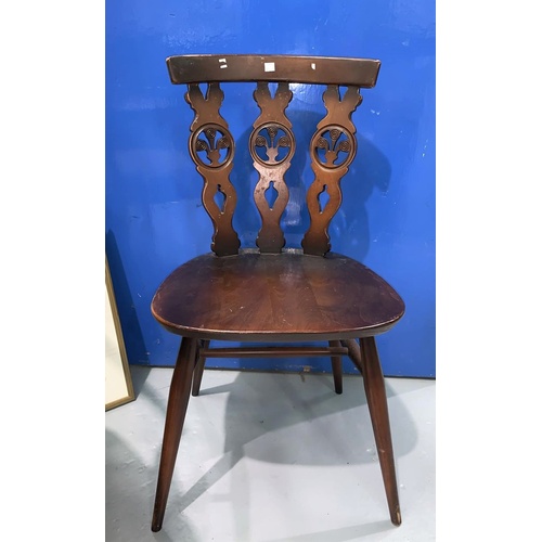 676 - A pair of Ercol Fleurs de Lys dining chairs