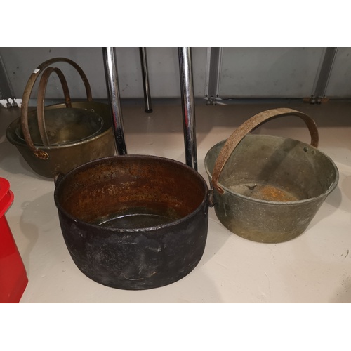 62 - Three 19th century jam pans; an oval pan