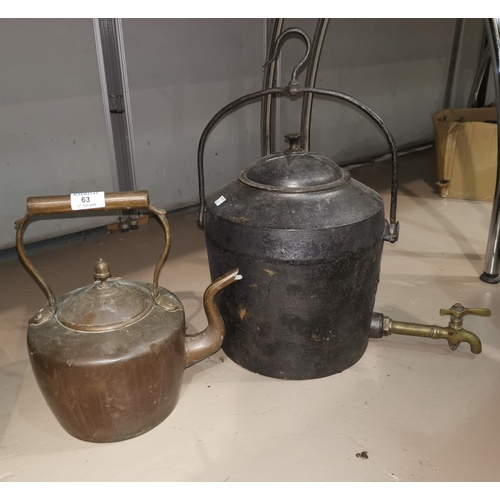 63 - A 19th century copper kettle; a large 19th century cast iron kettle;