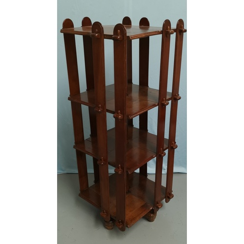 605 - A 3 height revolving bookcase in slatted and pegged stained wood, height 116 cm
