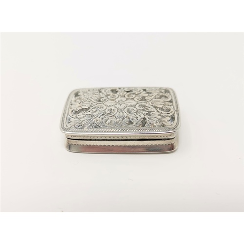 316 - A Georgian silver rectangular vinaigrette with monogrammed hinged lid and scroll chased relief decor... 