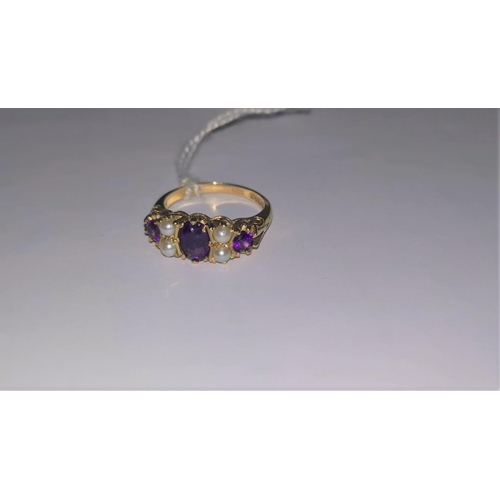 389 - A 9ct dress ring with three amethyst coloured stones and four seed pearls