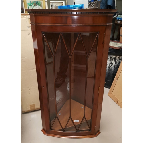 676 - A reproduction yew wood wall hanging corner cupboard and nest of tables