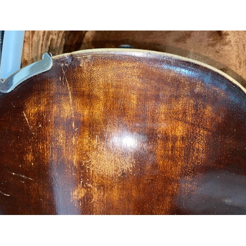 235 - An Antique violin with carved lion's head scroll, stamped DUKE below the button, dark varnish, 2 pie... 