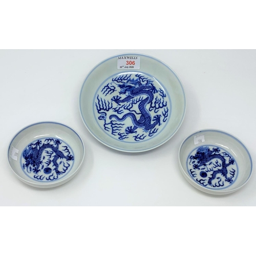 306 - A Chinese blue and white bowl decorated with central dragon, 6 character mark to base, 17cm; a pair ... 