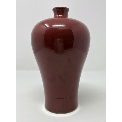 307 - A Chinese deep red plum shaped ceramic vase, ht 20cm