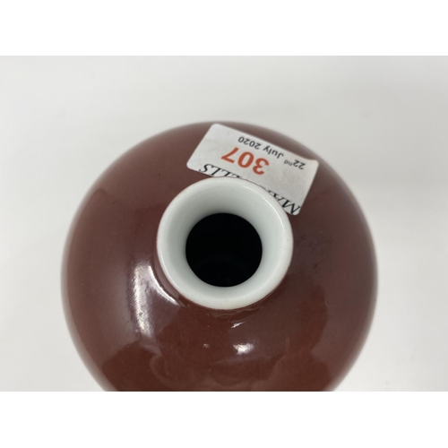 307 - A Chinese deep red plum shaped ceramic vase, ht 20cm