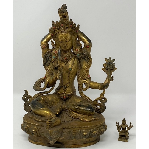 308 - A gilt figure of a Tibetan Buddha, ht 23cm; other similar miniature figures